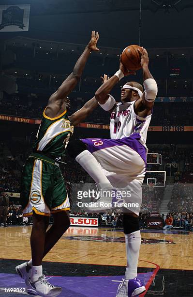 Jerome Williams of the Toronto Raptors drives to the basket against Reggie Evans of the Seattle Sonics during the NBA game at Air Canada Centre on...