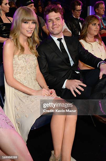 Singer Taylor Swift and Austin Swift attend the 2013 CMT Music awards at the Bridgestone Arena on June 5, 2013 in Nashville, Tennessee.
