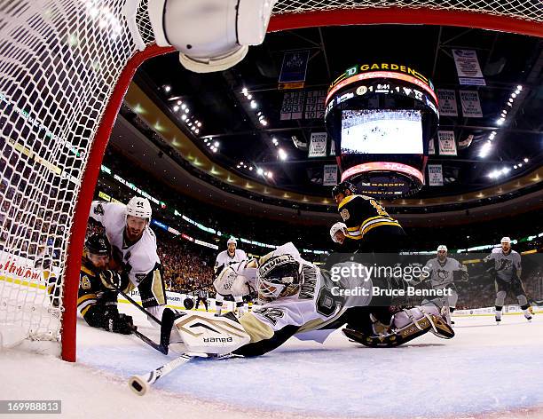 Tomas Vokoun of the Pittsburgh Penguins makes a save against David Krejci of the Boston Bruins as Brooks Orpik of the Pittsburgh Penguins defends...