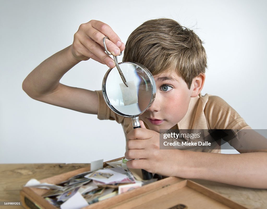 Child collecting postage stamps