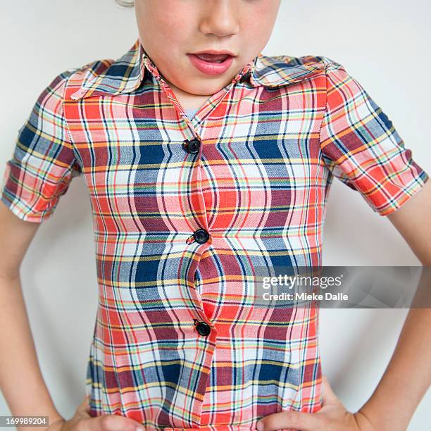 boy bursting out of his shirt - clothing too small stock pictures, royalty-free photos & images