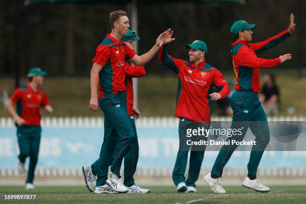 Billy Stanlake of Tasmania celebrates the dismissal of Sam Elliott of Victoria during the Marsh One Day Cup match between Victoria and Tasmania at...