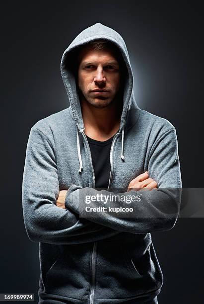 urban man in focus - folded hoodie stock pictures, royalty-free photos & images