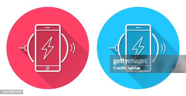 smartphone charging on wireless charger. round icon with long shadow on red or blue background - phone charging stock illustrations