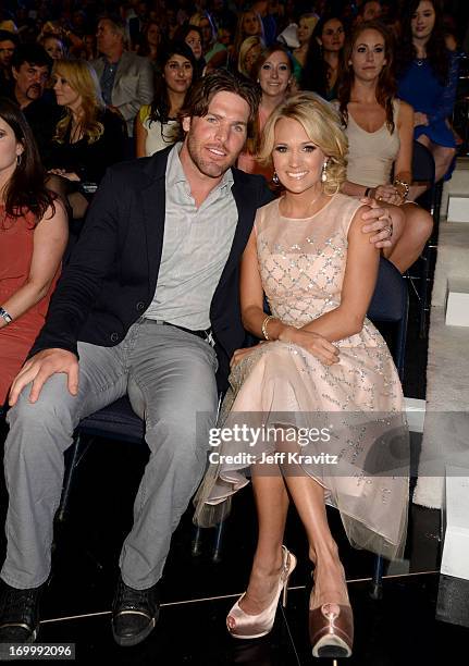 Singer Carrie Underwood and husband Mike Fisher attend the 2013 CMT Music Awards at the Bridgestone Arena on June 5, 2013 in Nashville, Tennessee.