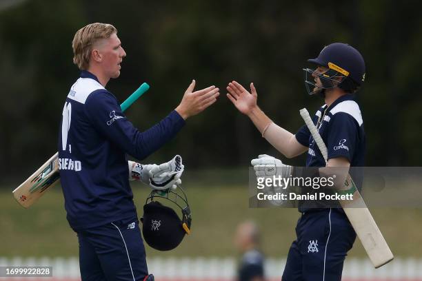 Will Sutherland of Victoria and Fergus O'Neill of Victoria celebrate winning the Marsh One Day Cup match between Victoria and Tasmania at CitiPower...