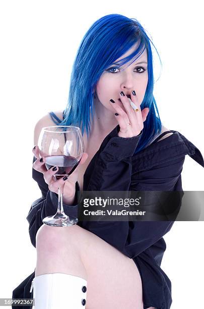 blue haired teen sucking on unlit cigarette - girl with blue hair stock pictures, royalty-free photos & images