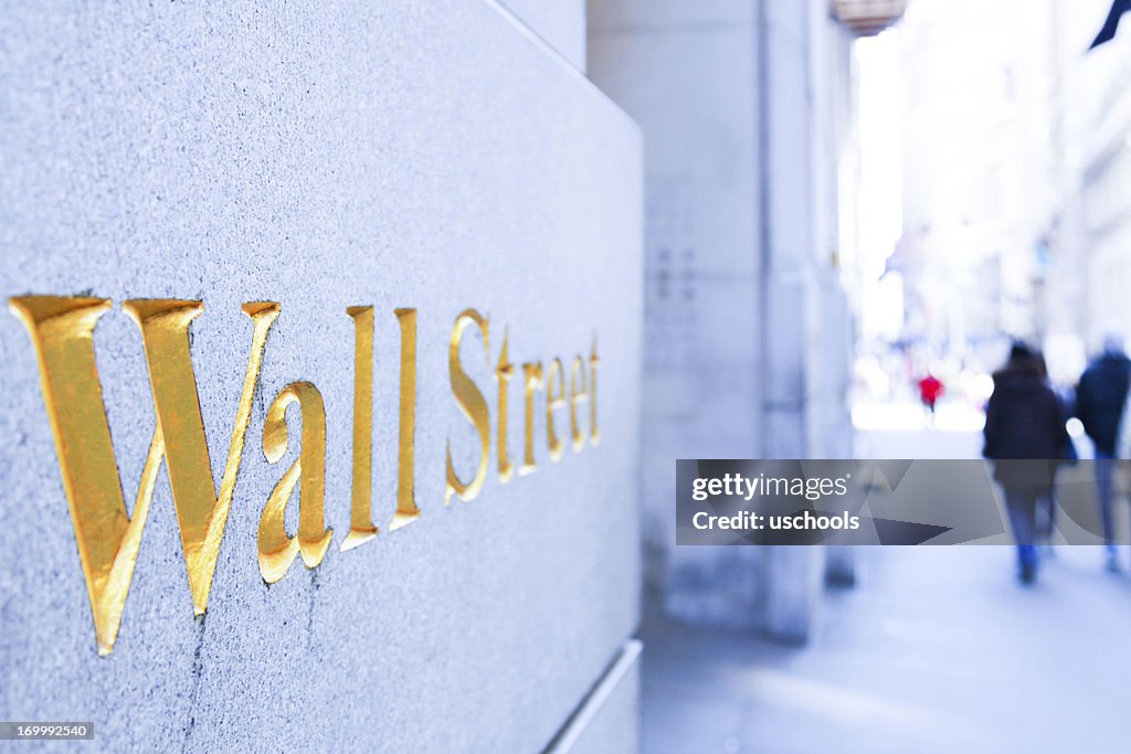 People Walking on the Wall Street