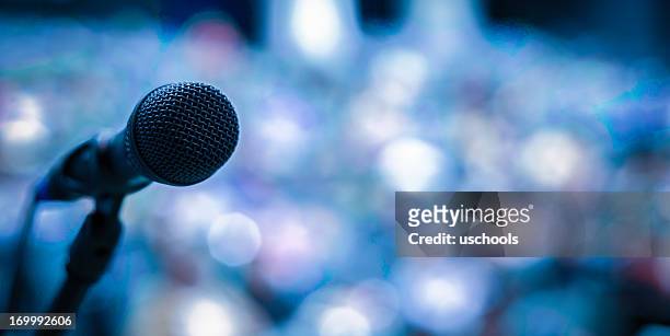 microphone on the stage - press conference stock pictures, royalty-free photos & images