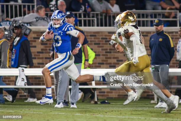Duke Blue Devils quarterback Riley Leonard springs for a big run setting up for a touchdown on the drive during the college football between the Duke...