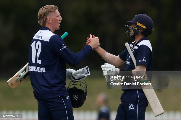 Will Sutherland of Victoria and Fergus O'Neill of Victoria celebrate winning the Marsh One Day Cup match between Victoria and Tasmania at CitiPower...