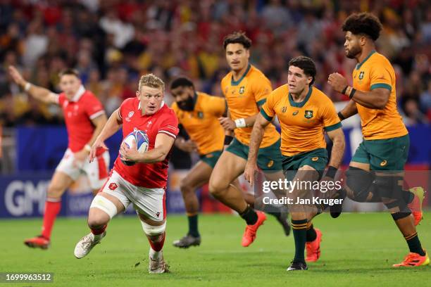 Jac Morgan of Wales runs with the ball during the Rugby World Cup France 2023 match between Wales and Australia at Parc Olympique on September 24,...