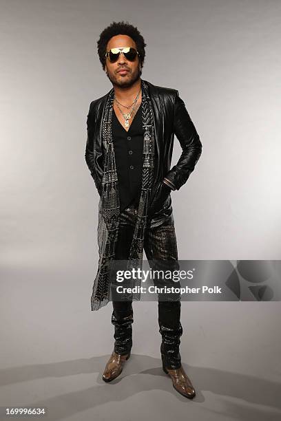 Lenny Kravitz poses at the Wonderwall portrait studio during the 2013 CMT Music Awards at Bridgestone Arena on June 5, 2013 in Nashville, Tennessee.