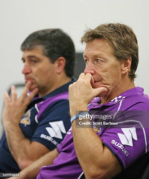 Storm football manager Frank Ponissi and Storm coach Craig Bellamy listen as Gerry Ryan, Storm Non-Executive Chairman Bart Campbell and Matthew Tripp...