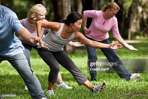 tai chi class - tai chi stock pictures, royalty-free photos & images