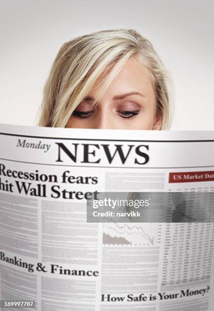 girl reading newspaper with economic news - headlines stock pictures, royalty-free photos & images