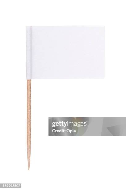 white paper flag with toothpick pole - small stockfoto's en -beelden