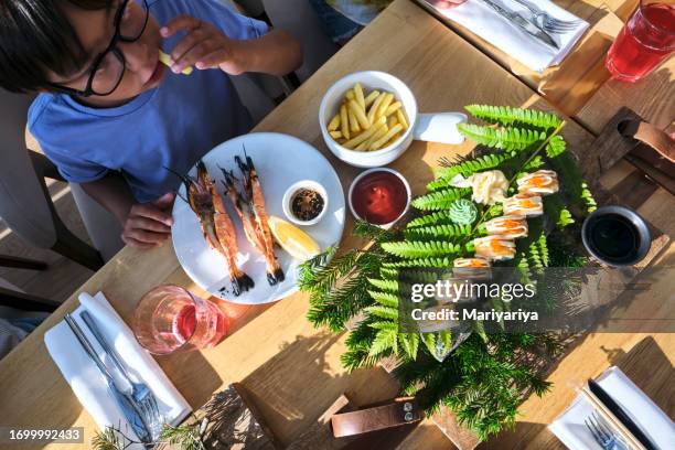 a table with an abundance of beautiful asian dishes and rolls. view from above. - love potion stock pictures, royalty-free photos & images