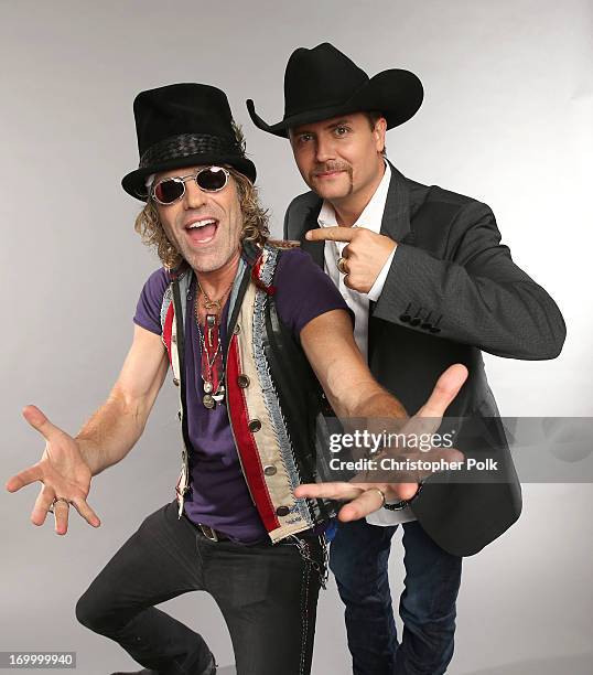 Singers/musicians Big Kenny and Jon Rich pose at the Wonderwall portrait studio during the 2013 CMT Music Awards at Bridgestone Arena on June 5, 2013...