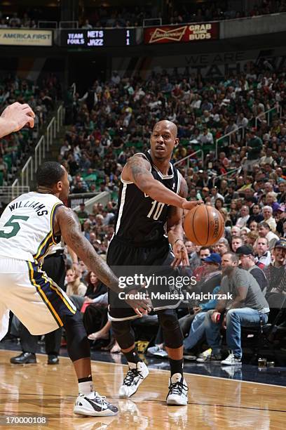 Keith Bogans of the Brooklyn Nets passes the ball against Mo Williams of the Utah Jazz at Energy Solutions Arena on March 30, 2013 in Salt Lake City,...