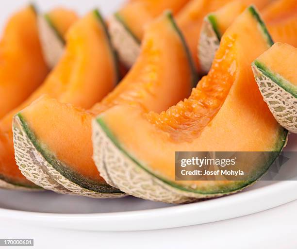 sliced cantaloupe melons on a plate - muskmelon stock pictures, royalty-free photos & images