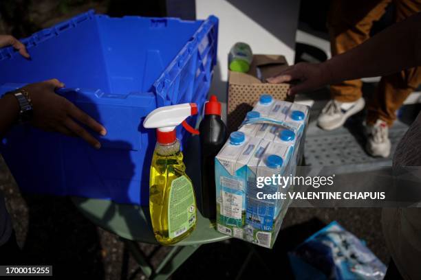 Woman picks up a package sold by the RERTer association , in Limogne-en-Quercy, southwestern France, on September 27, 2023. The RERTer association...