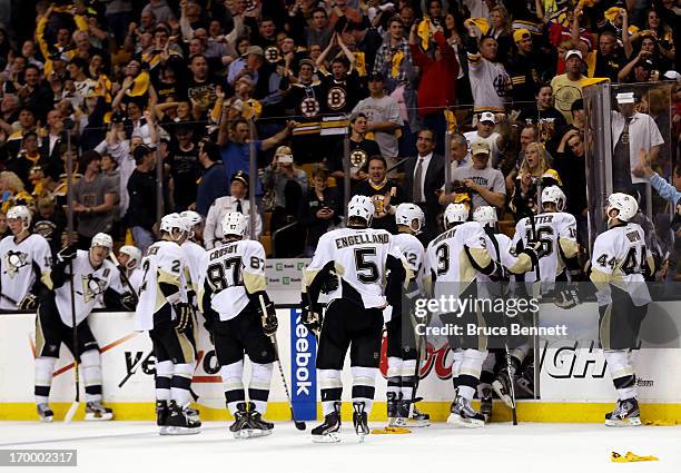 The Pittsburgh Penguins leave the ice after losing to the Boston Bruins 2-1 in double overtime on a goal scored by Patrice Bergeron in Game Three of...