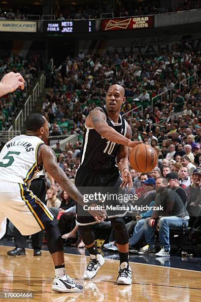 Keith Bogans of the Brooklyn Nets passes the ball against Mo Williams of the Utah Jazz at Energy Solutions Arena on March 30, 2013 in Salt Lake City,...