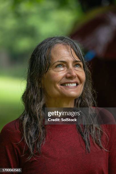 feeling happy on race day - older woman wet hair stock pictures, royalty-free photos & images
