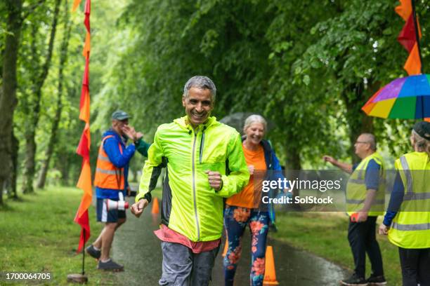 success feels better together - reflective clothing run stock pictures, royalty-free photos & images