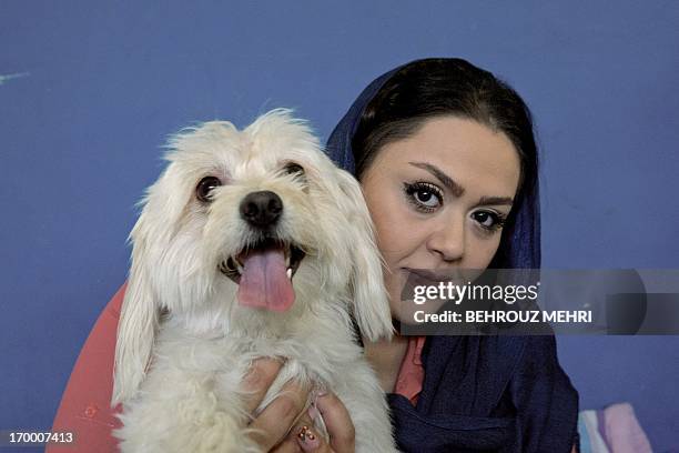 Iranian Media poses for a picture with her Terrier dog, Shiny in her... News Photo - Getty Images Iranian Media poses for a picture with her Terrier dog, Shiny in her... News Photo - Getty Images