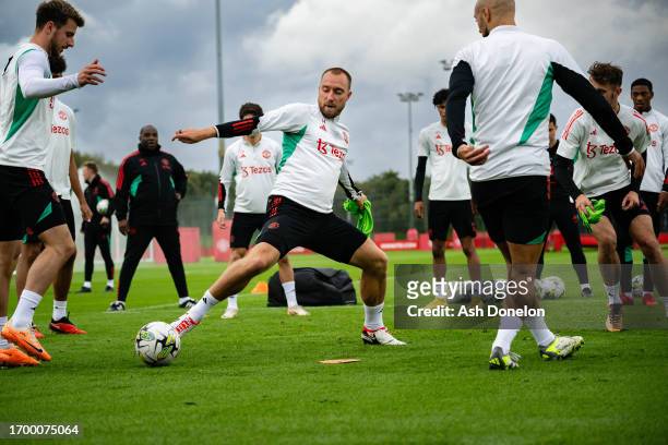 Mason Mount and Christian Eriksen of Manchester United in action during a first team training session at Carrington Training Ground on September 24,...