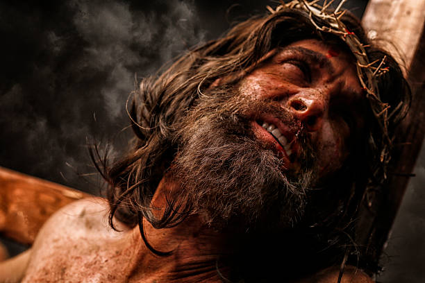 jesus christ on cross in pain - christ on the cross stock pictures, royalty-free photos & images