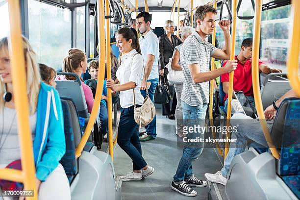 people on the bus. - getting on bus stockfoto's en -beelden