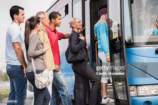 people boarding a bus. - senior public transportation stock pictures, royalty-free photos & images