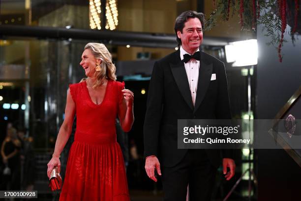 Laura Blythe and AFL CEO Gillon McLachlan share a laugh as they arrive ahead of the 2023 Brownlow Medal at the Crown Palladium on September 25, 2023...