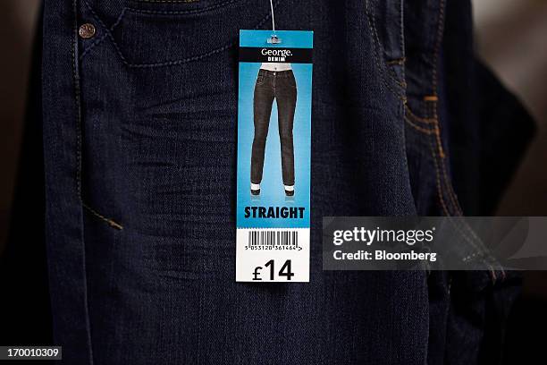 Price tag sits on a pair of ladies straight cut George branded denim jeans, manufactured in Bangladesh for the Asda supermarket chain, the U.K....