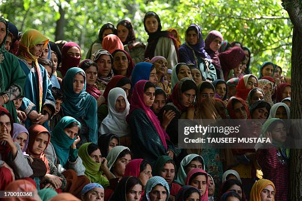 Kashmiri Muslim villagers watch the funeral of self styled divisional commander of Jaish-e-Mohammad , Altaf Baba alias Gazi Baba at Algar-Kandi in...