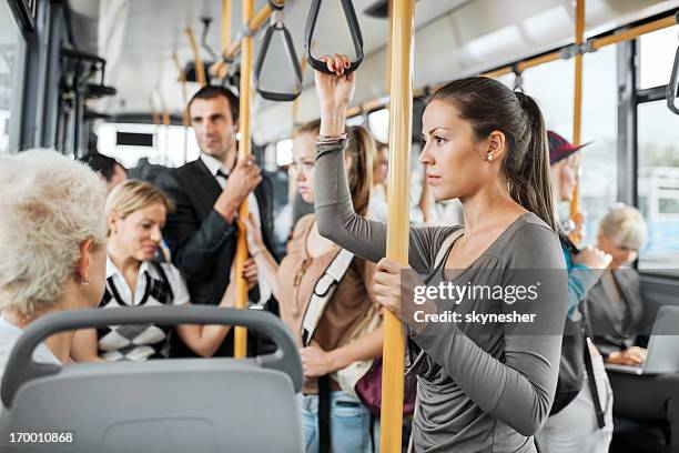 crowded bus - large group of people serious stock pictures, royalty-free photos & images