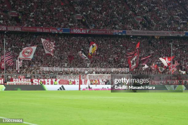 Supporters of Bayern Munich show message during the Bundesliga match between FC Bayern München and Bayer 04 Leverkusen at Allianz Arena on September...