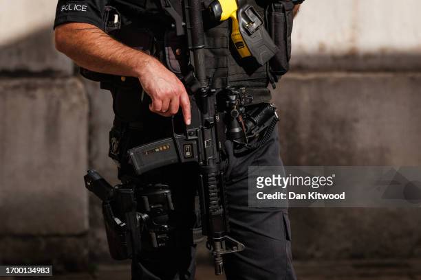 An armed police officer in central Westminster on September 25, 2023 in London, England. It has been reported that more than 100 officers have turned...