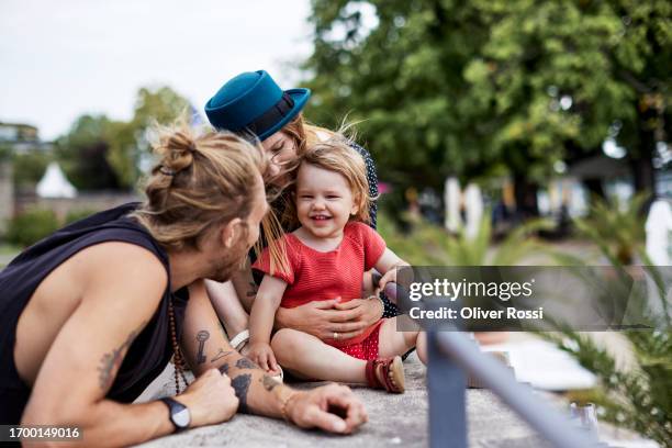 happy family at a railing - father and daughter tattoos stock pictures, royalty-free photos & images