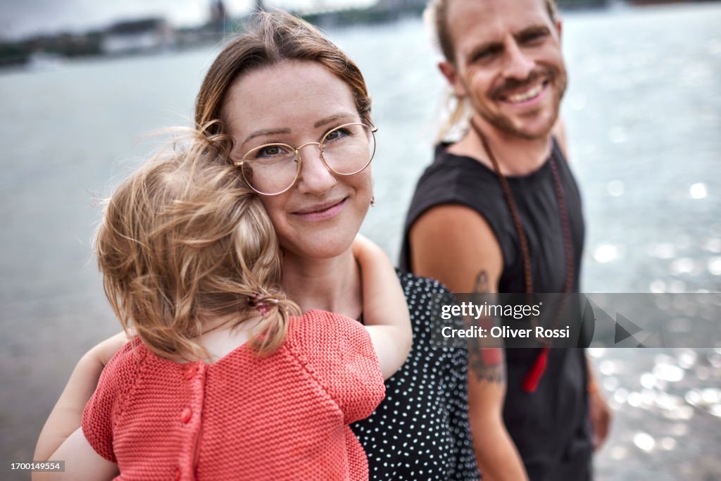 Happy family at a riverbank