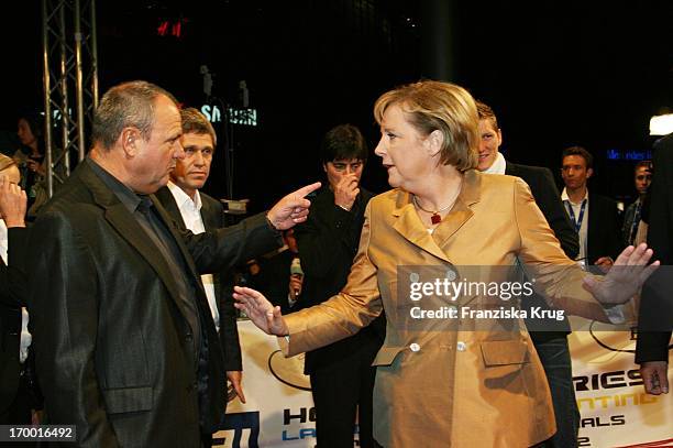 German Chancellor Angela Merkel and Dfb spokesman Harald Stenger At The Premiere Of Cinema Films By S. Wortmann "Germany A Summer Fairytale" on...