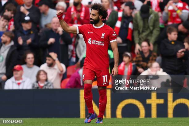 Mohamed Salah of Liverpool celebrates after scoring the team's first goal during the Premier League match between Liverpool FC and West Ham United at...