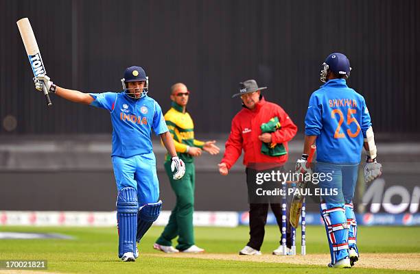 India's Rohit Sharma celebrates his half century 50 during the 2013 ICC Champions Trophy cricket match between India and South Africa at the Cardiff...