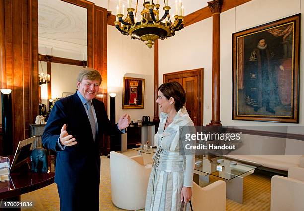 In this handout photo provided by the Dutch National Press Agency, King Willem-Alexander of the Netherlands receives Dutch politician Anouchka van...