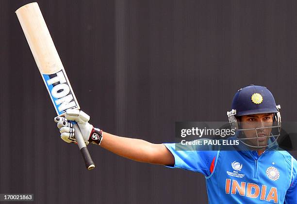 India's Rohit Sharma celebrates his half century during the 2013 ICC Champions Trophy cricket match between India and South Africa at the Cardiff...