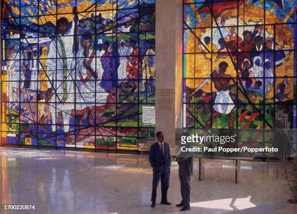 Two men stand in a reception area of Africa Hall, the headquarters building of the United Nations Economic Commission for Africa , in the centre of...