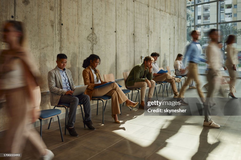 Group of business people waiting for job interview in the office.